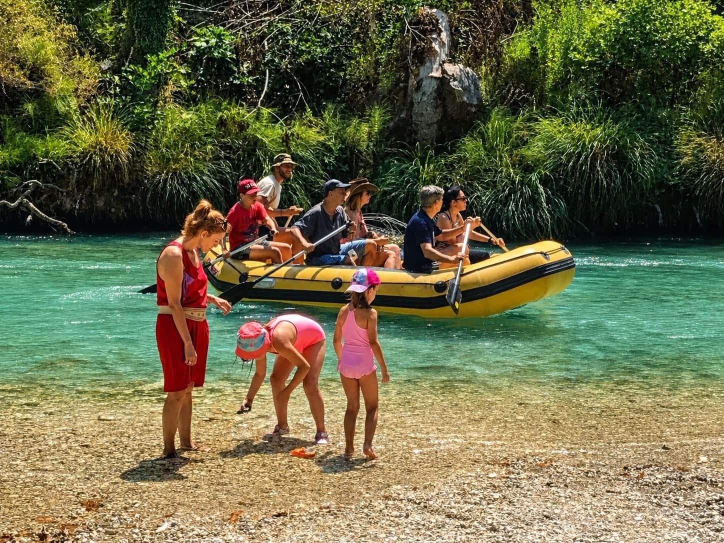 Family enjoying a summer day by the Acheron River